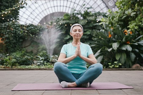 Aging adult doing yoga